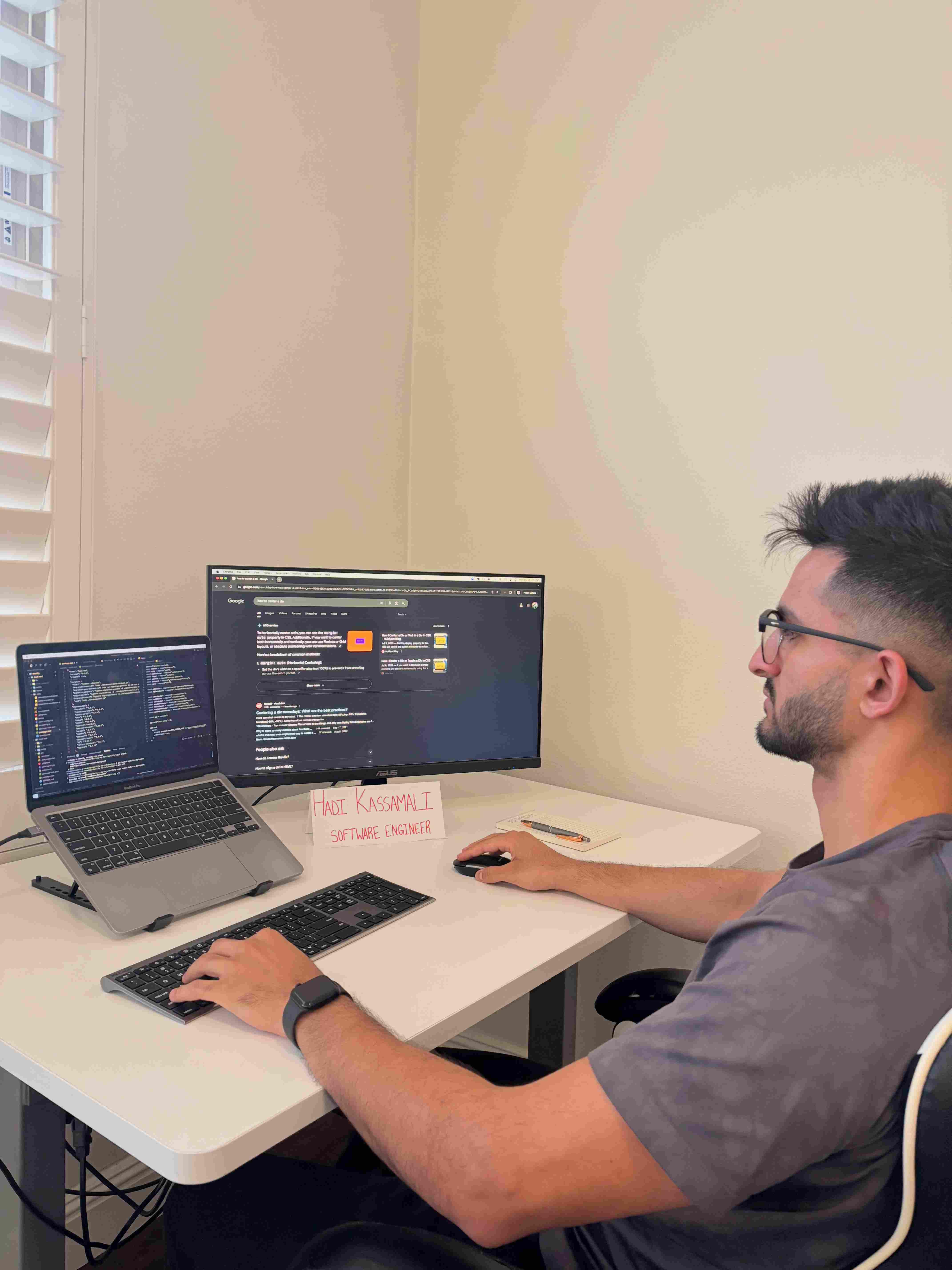 Hadi working at his desk